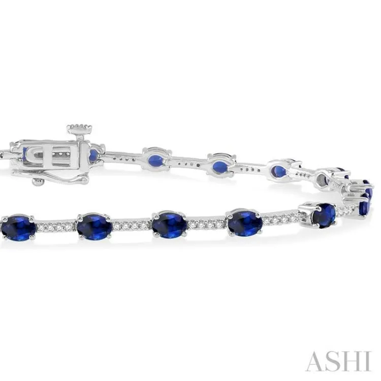 1/3 Ctw Round Cut Diamond & 4x3MM Oval Cut Sapphire Precious Bracelet in 10K White Gold